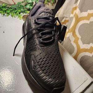 Solid black Nike athletic shoes size 7.6